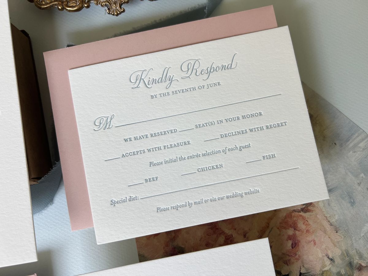 Letterpress wedding invitation suite in dusty blue on cream cotton paper with a blush envelope, image 1 of 6
