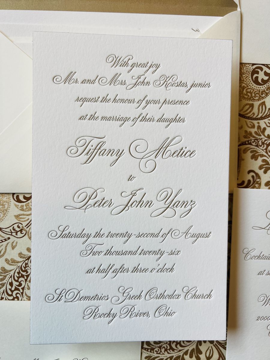 Letterpress wedding invitation suite in gold and cream with a patterned envelope liner, image 1 of 9