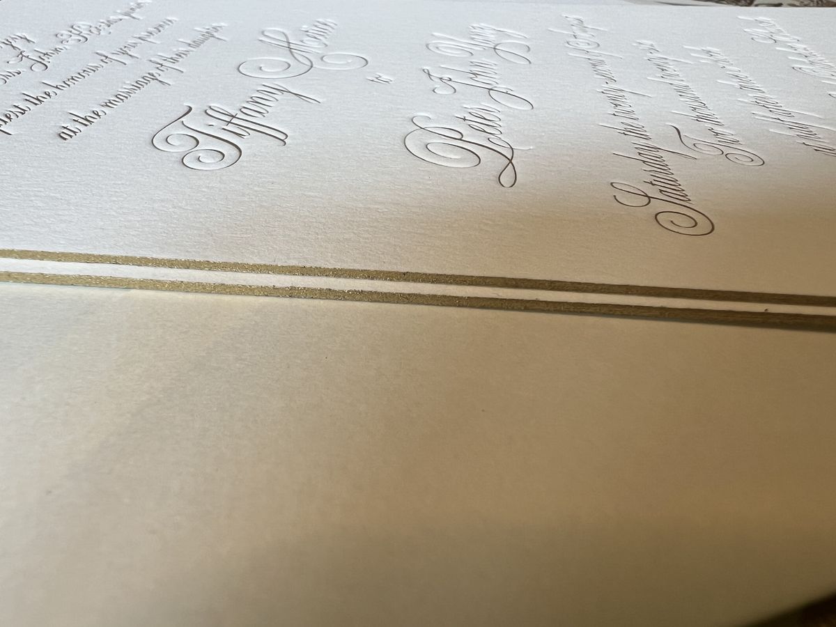 Letterpress wedding invitation suite in gold and cream with a patterned envelope liner, image 9 of 9